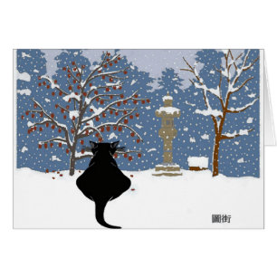 Chat noir observant la neige