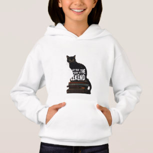Chat noir sur livres "Skip to Weekend"