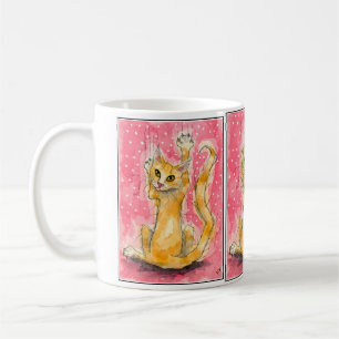 Chat orange triple sur la tasse à pois rose