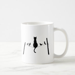 chat parmi la tasse de pigeons