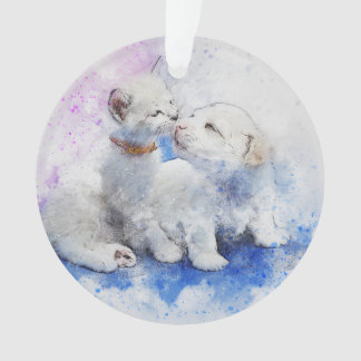 Chaton blanc et ornement blanc de chiot