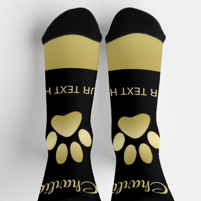 Chaussette Paw chien brillant or sur arrière - plan noir (Haut)