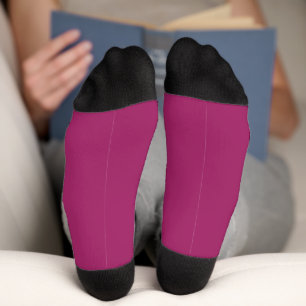 Chaussette un arrière - plan rose avec un blanc
