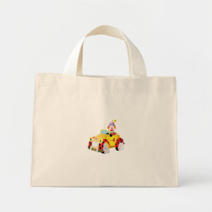 cheerful clown drives a whimsical yellow car mini tote bag