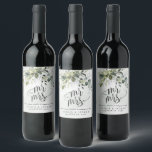 Cheers to Love Laughter Happily Ever After Wedding Wine Label<br><div class="desc">Design features a bouquet of watercolor greenery, eucalyptus and a succulent over a dusty blue watercolor splash. Design also features specks of painted (printed) gold and green. Mr and Mrs is printed in a unique design. Cheers to love, laughter & happily ever after is printed below the Mr & Mrs...</div>