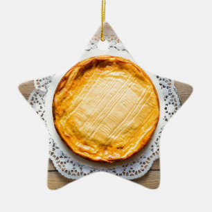 Cheesecake on rustic wood cake top. ceramic ornament