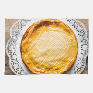 Cheesecake on rustic wood cake top. kitchen towel