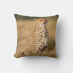 Cheetah on small mound for better visibility throw pillow
