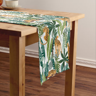 Chemin De Table Court Brown leopard in the tropical lush jungle leaves