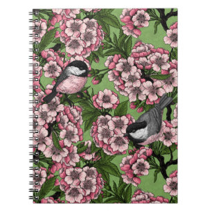 Cherry blossom and chickadees on green notebook