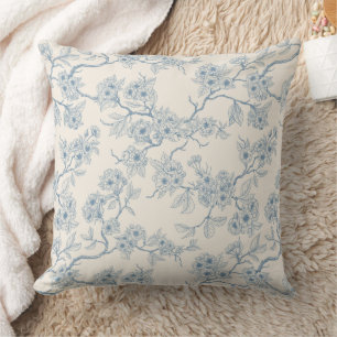Chery blossom branches in blue and off white throw pillow
