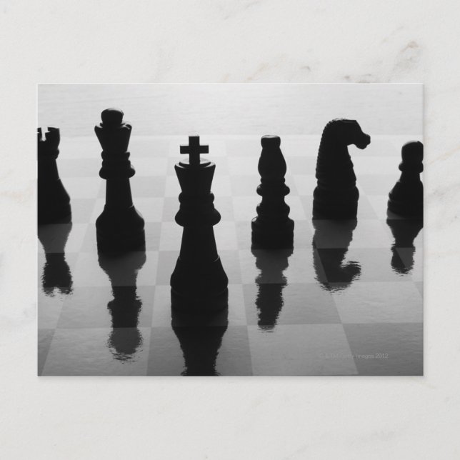 Chess pieces on chess board in black and white postcard (Front)
