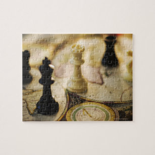 Chess pieces on old world map jigsaw puzzle