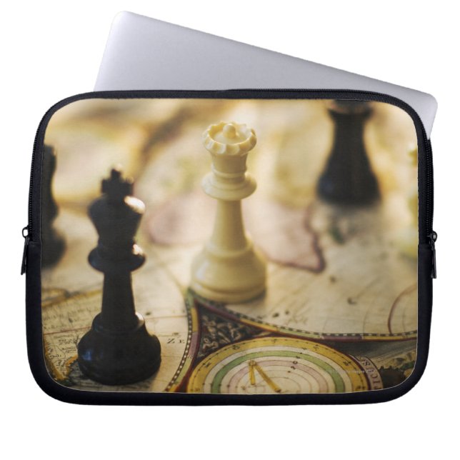 Chess pieces on old world map laptop sleeve (Front)