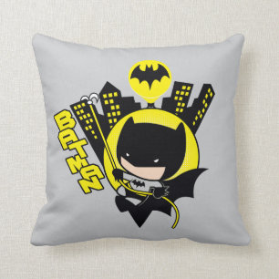 Chibi Batman Scaling The City Throw Pillow