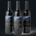 Chic Agate Geode Blue Gold 70th Birthday Party Wine Label<br><div class="desc">These chic 70th birthday wine bottle labels feature a watercolor image of an agate geode in shades of blue with faux gold glitter highlights. The words "70th Birthday" appear in faux gold glitter in a decorative modern handwriting font. Customize it with the name of the honoree and the date in...</div>
