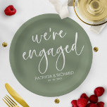 Chic Calligraphy We're Engaged Engagement Party Paper Plate<br><div class="desc">A stylish calligraphy engagement party paper plate. Easy to personalize with your details. CUSTOMIZATION: If you need design customization,  please contact me through chat; if you need information about your order,  shipping options,  etc.,  please get in touch with Zazzle support directly.</div>