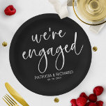 Chic Calligraphy We're Engaged Engagement Party Paper Plate<br><div class="desc">A stylish calligraphy engagement party paper plate. Easy to personalize with your details. CUSTOMIZATION: If you need design customization,  please contact me through chat; if you need information about your order,  shipping options,  etc.,  please get in touch with Zazzle support directly.</div>