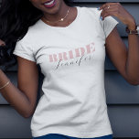 Chic Dusty Pink Bold Script Calligraphy Bride Name T-Shirt<br><div class="desc">Celebrate your bachelorette with this elegant,  minimalist t-shirt,  featuring bold dusty pink typography and elegant calligraphy name. Easily add your own details by clicking on the "personalize" option.</div>