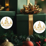 Chic Gold Snowflakes Christmas Tree Personalized Classic Round Sticker<br><div class="desc">A chic gold script Christmas gift sticker with your family name under beautiful trees made of golden snowflakes above Merry Christmas. Trendy holiday stickers with an artistic snowflake design.</div>