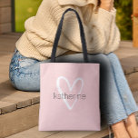 Chic Heart Personalized Blush Pink  Tote Bag<br><div class="desc">This blush pink tote bag is personalized with your name in a simple font over a large white heart. Ideal for yourself,  for your bridesmaids,  book club,  graduation gift,  birthday gift,  teacher's gift or any occasion. MORE colours in our store.</div>