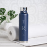 Chic Monogram on Blue Water Bottle<br><div class="desc">Chic white vertical monogram on blue features a larger more decorative initial in the centre. Replace the 3 initials with your own in the sidebar.

Other water bottle colours and styles available in the sidebar.

Copyright © Claire E. Skinner. All rights reserved.</div>