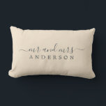 Chic Newlywed Mr Mrs Ivory Monogram Lumbar Pillow<br><div class="desc">Chic, modern monogrammed ivory pillow with the text Mr and Mrs in off-black elegant script on an ivory background. The colour magnolia blossom is used for this stylish design. Simply add your married name. Perfect luxury wedding gift for the newlywed couple. Exclusively designed for you by Happy Dolphin Studio. If...</div>