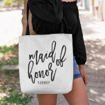 Chic Script Personalized Maid of Honour Tote Bag<br><div class="desc">Gift your maid of honour with this super cute personalized tote bag! Trendy and modern black and white design features "maid of honour" in black handwritten script typography. Easily customize with your maid of honour's name using the template field provided.</div>