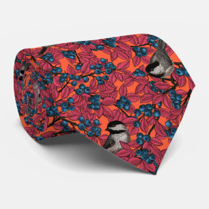 Chickadee birds on blueberry branches on orange tie