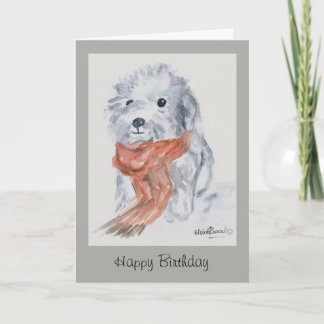 Chien avec la carte de joyeux anniversaire