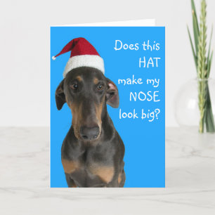 Chien drôle avec la carte de Noël de casquette de
