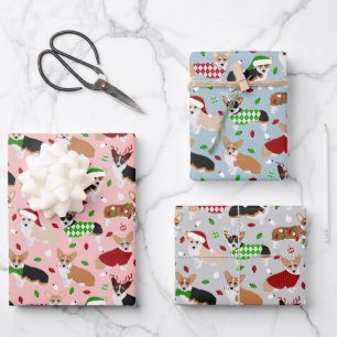 Chiens de Noël Enveloppant des feuilles de papier