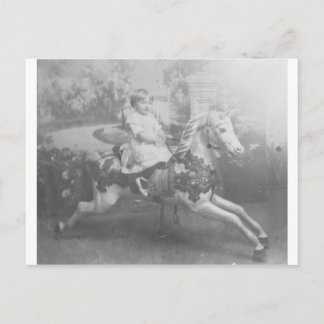 child on carousel horse postcard