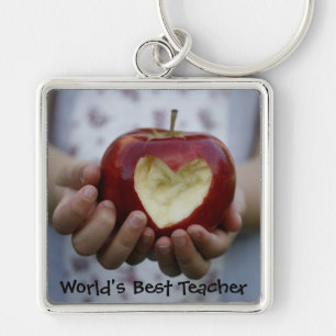 Child with apple heart keychain