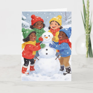 Children build a snowman holiday card