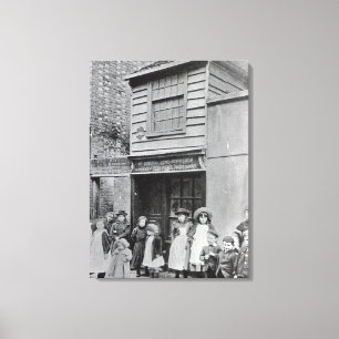 Children outside John Pounds's workshop Canvas Print