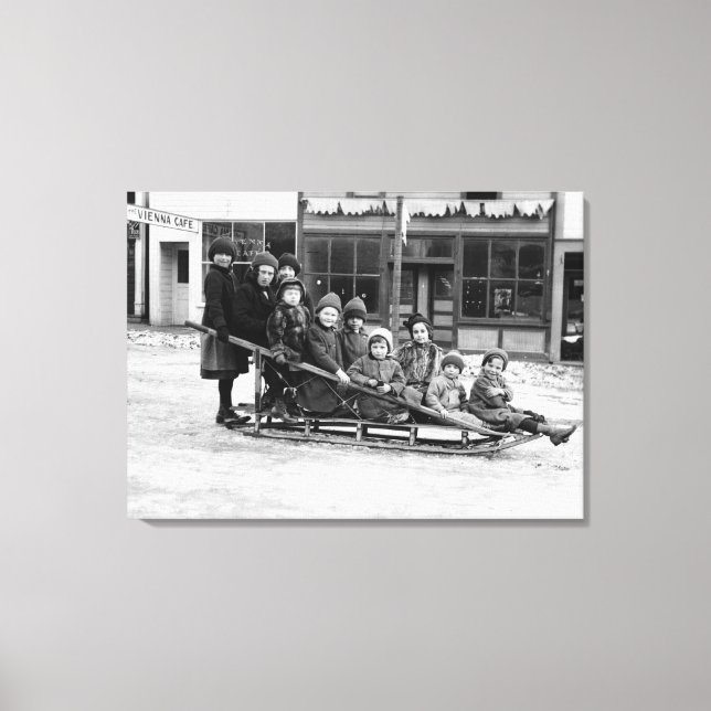 Children Playing on Sleigh in Seward Canvas Print (Front)