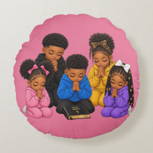 Children praying round pillow