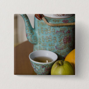 China, Hong Kong. Traditional Chinese teapot & 2 Inch Square Button