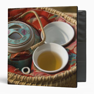 China, Hong Kong. Traditional Chinese teapot & 3 Binder