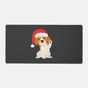 Chiot Beagle avec le chapeau du Père Noël pour les