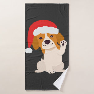Chiot Beagle avec le chapeau du Père Noël pour les
