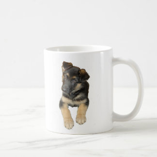 Chiot de berger allemand et dire sur une tasse