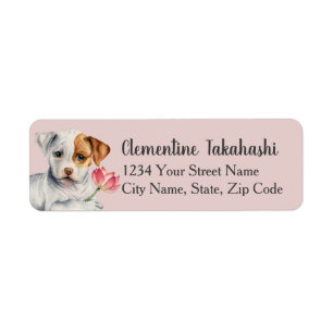 Chiot de pitbull tenant l'adresse de fleur de