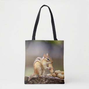 Chipmunk eating a peanut tote bag