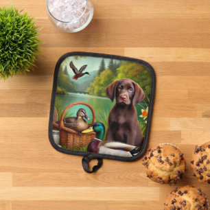 Chocolate Labrador Puppy by a Lake with Ducks Pot Holder