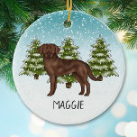 Chocolate Labrador Retriever Custom Name Christmas Ceramic Ornament<br><div class="desc">Destei's original cartoon illustration of a cute chocolate brown Labrador Retriever breed dog. The dog is placed in a winter scene with green fir trees and falling snow. The background is a blue to white gradient giving the design that cold winter day look. There is also a personalizable text area...</div>