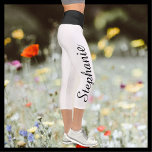 CHOOSE COLOR name black white yoga capri leggings<br><div class="desc">CHOOSE YOUR COLOR custom yoga capri leggings! Printed edge to edge, with your name in large black script up one leg! Sample is white with black waist, but you can easily customize to colour of your choice. Also easy to change or delete example name. All Rights Reserved © 2020 Alan...</div>