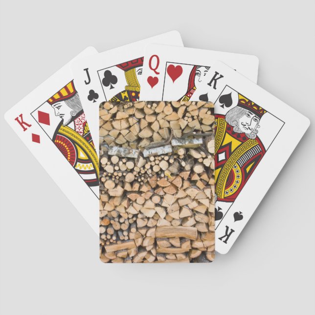 Chopped wood on a pile poker cards deck (Back)