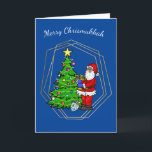Chrismukkah Santa with Menorah Christmas Card<br><div class="desc">This Chrismukkah card features Santa Claus holding a menorah by a Christmas tree with a star and lights. So, your holiday can be bright from either a Christmas tree or from the candles on the Menorah. Well, that's my idea anyway. But, you're free to change the inside greeting to suit...</div>